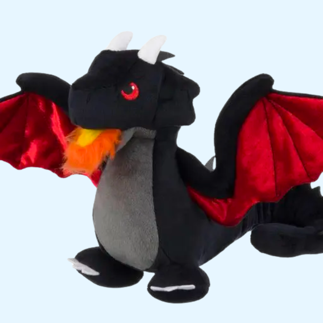 Dragon noir aux ailes rouges crachant une flamme orange