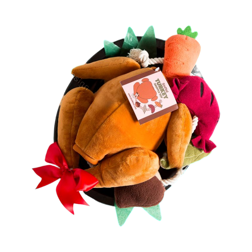 Dinde rôtie en peluche avec légumes sur un plat noir