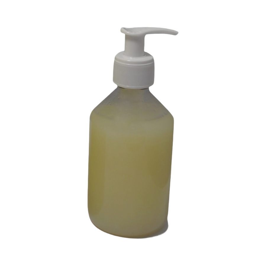 Flacon doseur transparent rempli d'huile jaune pâle