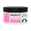 Pot blanc à couvercle noir, étiquette rose Repairing Cream