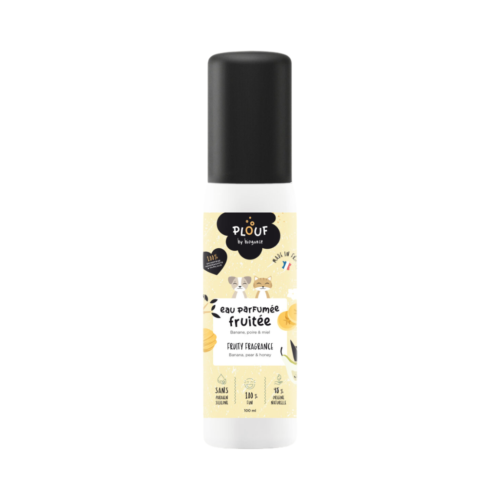 Flacon blanc à bouchon noir, étiquette jaune aux agrumes illustrée