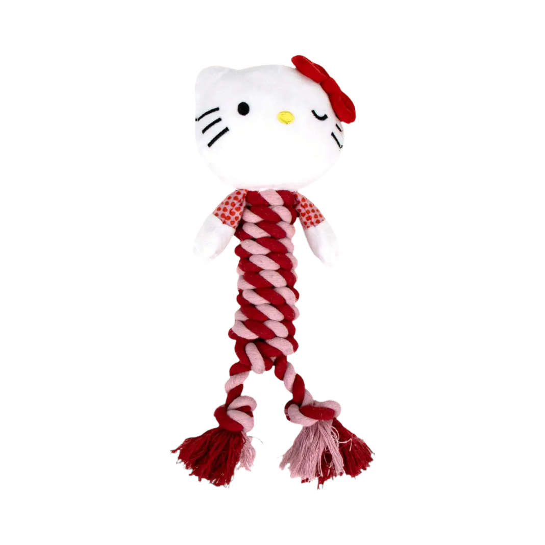 Chat blanc au nœud rouge sur corde tressée rouge et blanche