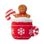 Tasse rouge à flocons avec bonhomme en pain d'épices et sucre d'orge