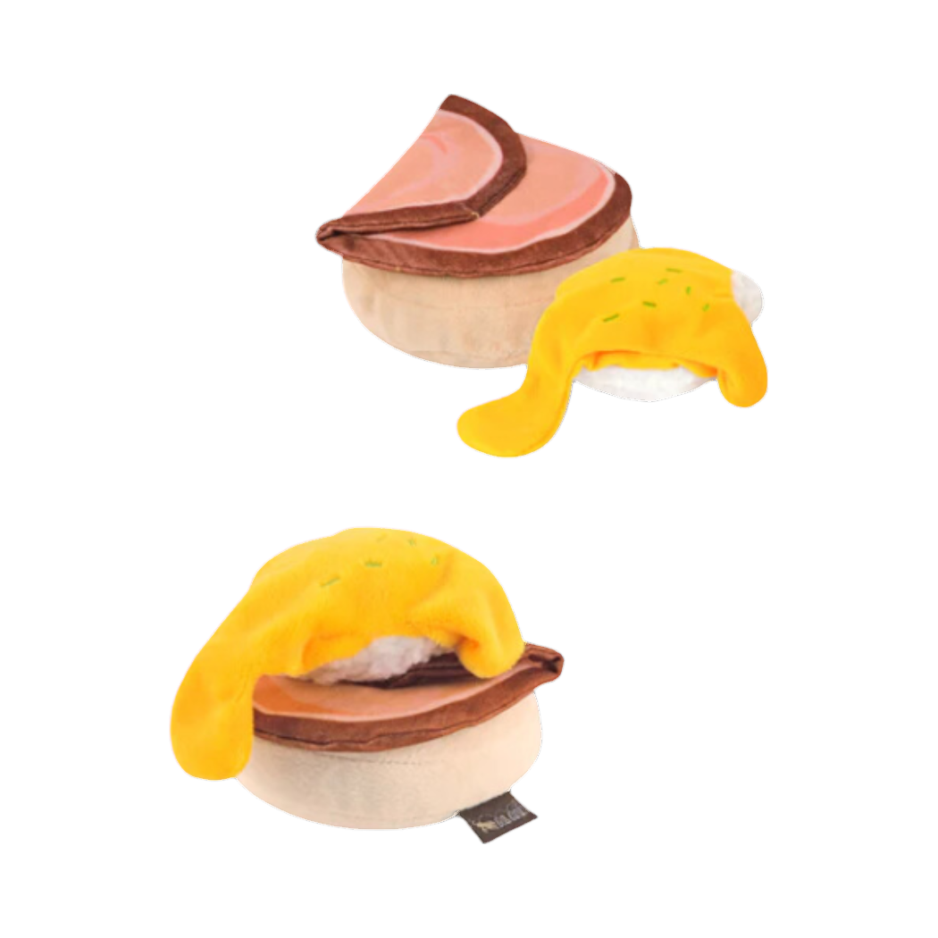 Deux œufs Bénédicte en tissu, jambon rose et sauce jaune