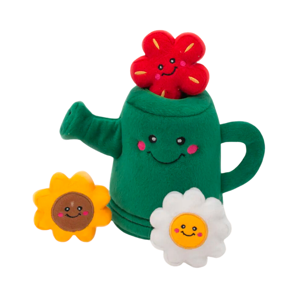 Arrosoir vert, fleur rouge dans le bec, tournesol et marguerite devant