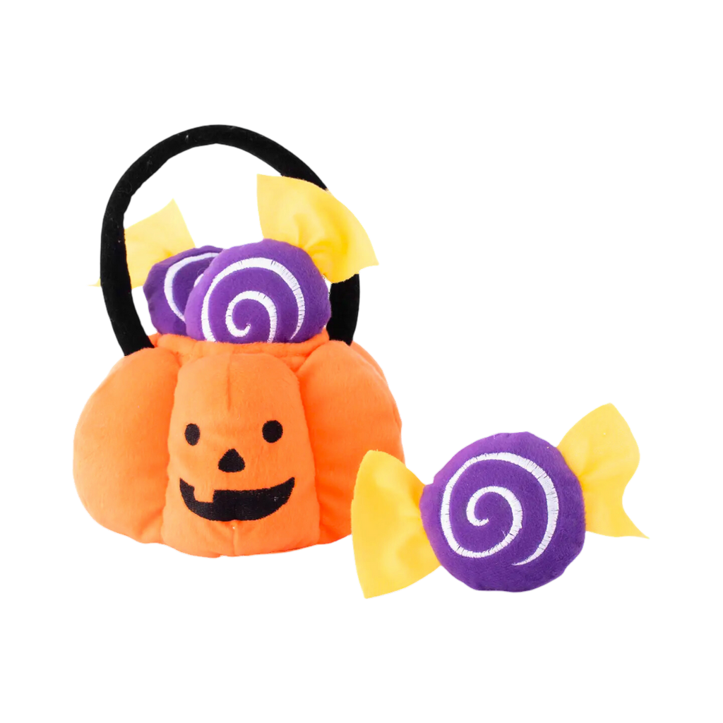 Panier citrouille orange à anse noire avec bonbons violets
