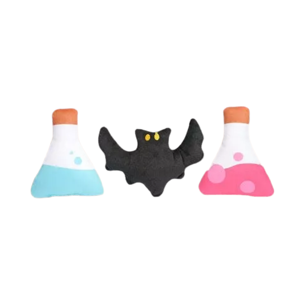 Fioles turquoise et rose avec une petite chauve-souris noire