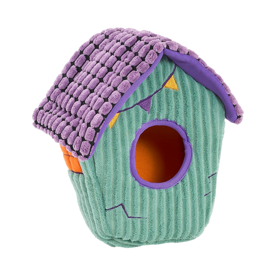 Maison hantée seule vue de biais, toit violet et entrée ronde