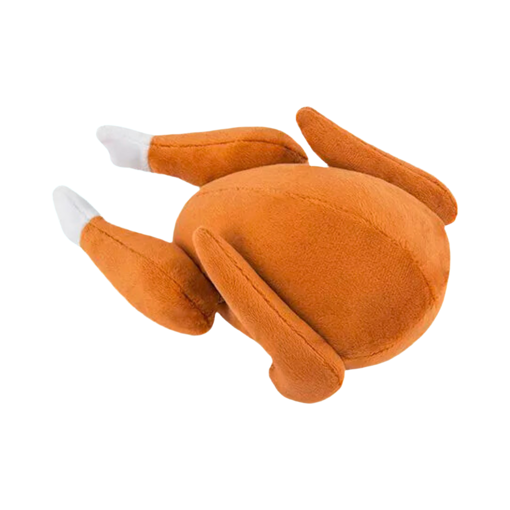 Volaille rôtie dorée en peluche aux pilons blancs, couchée
