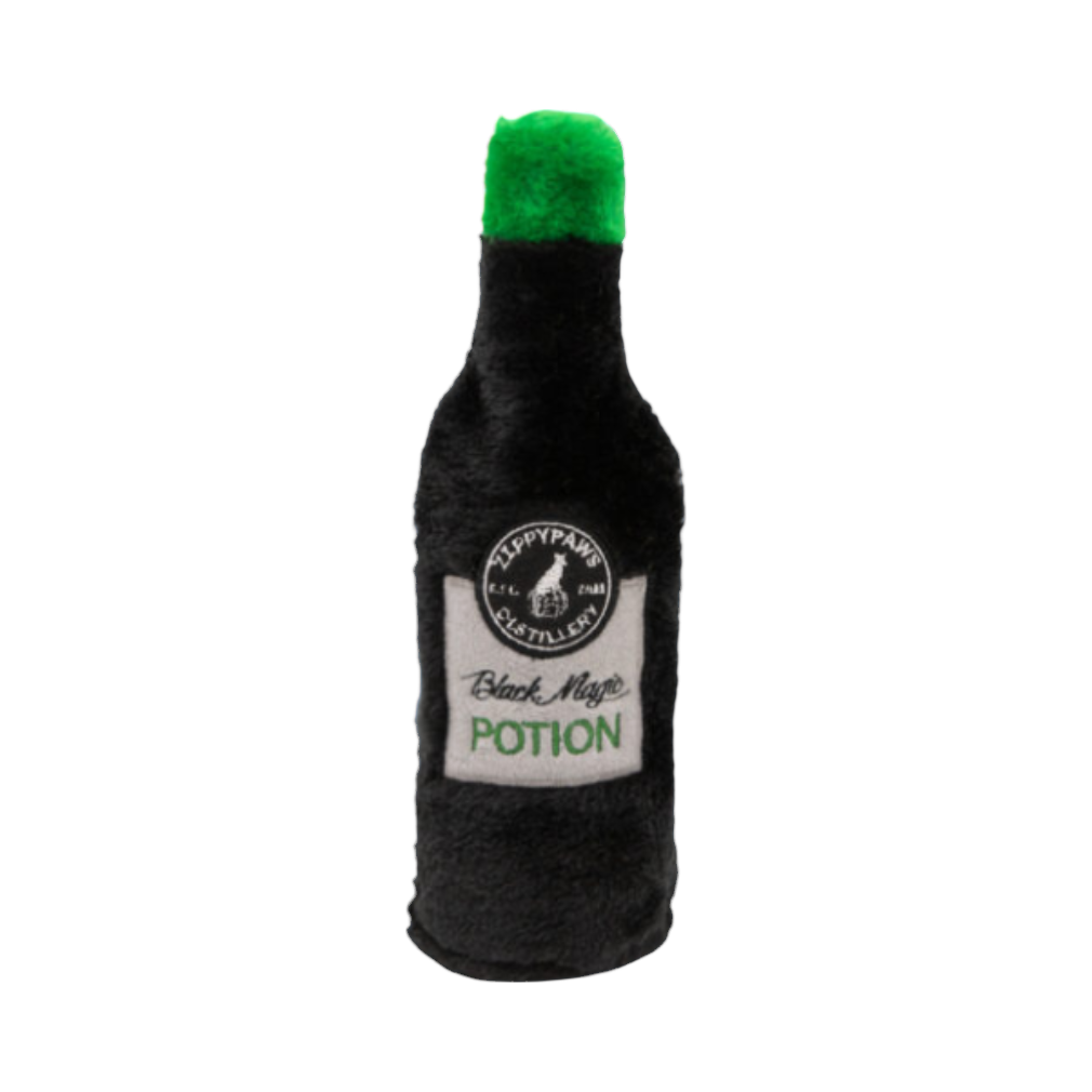 Bouteille noire pelucheuse à bouchon vert et étiquette Black Magic