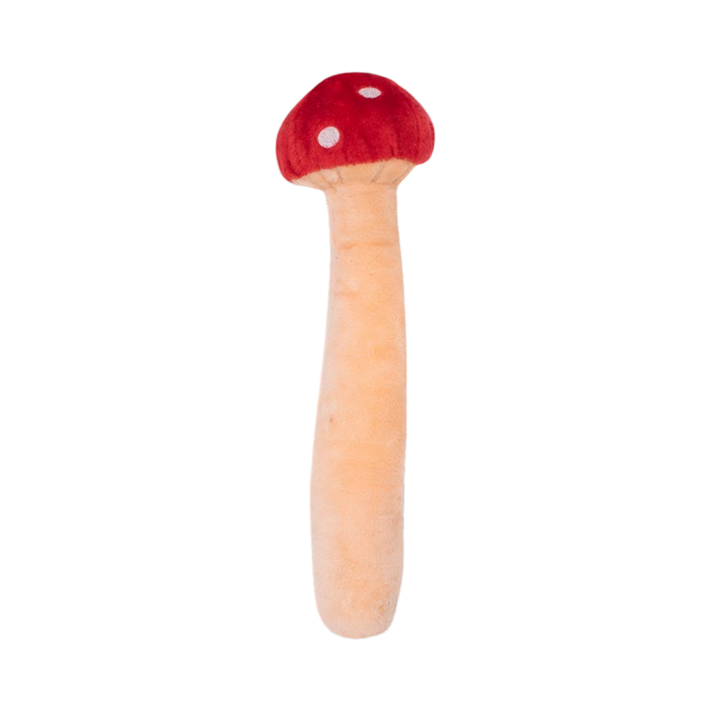 Champignon rouge et beige allongé, vu de dos