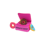 Boîte Donutz Shop rose vue en biais avec ses donuts