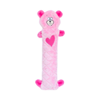 Ourson rose pâle allongé avec un cœur fuchsia sur le ventre