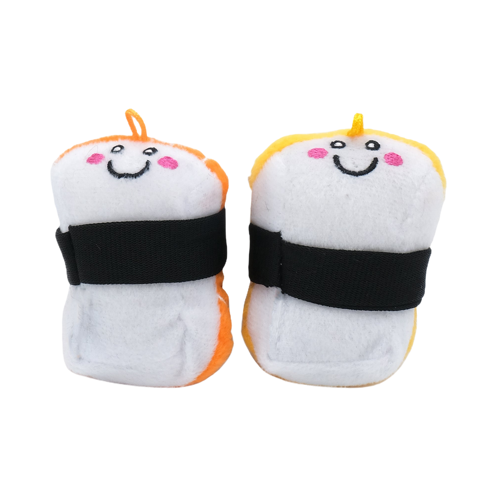 Deux sushis blancs à bande noire, face aux visages