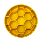 Assiette jaune à alvéoles hexagonales vue de dessus