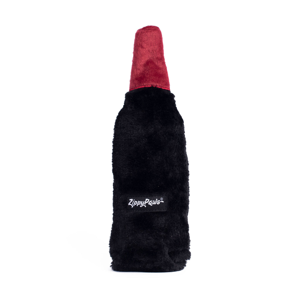 Dos de la peluche bouteille de vin rouge ZippyPaws avec son étiquette tissée
